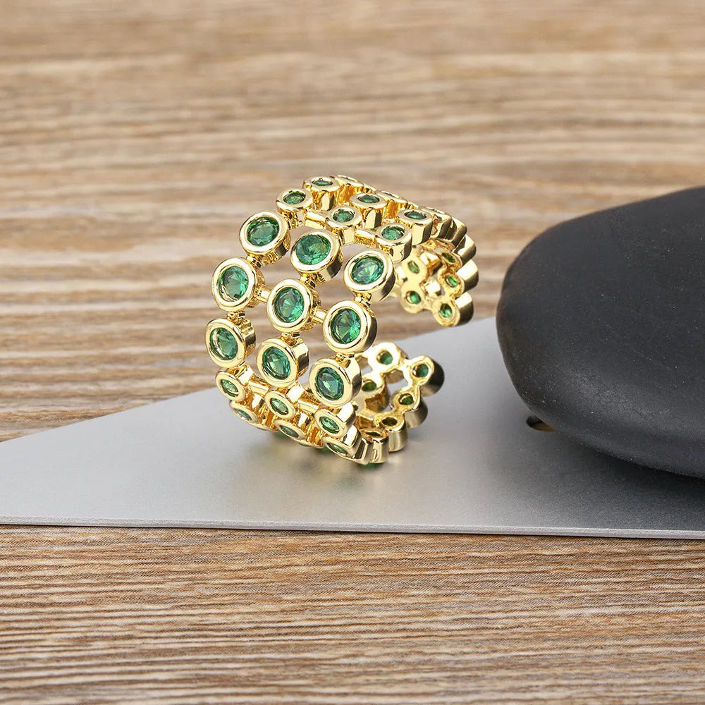 Wide band ring with three layers of green zircon stones and 18K gold plating