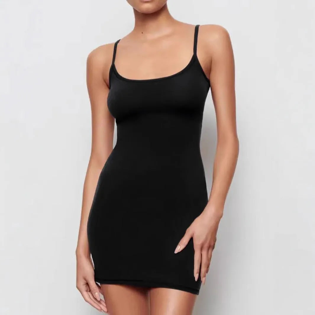 Black sleeveless sling dress with a short sheath skirt and fitted mid-waist.