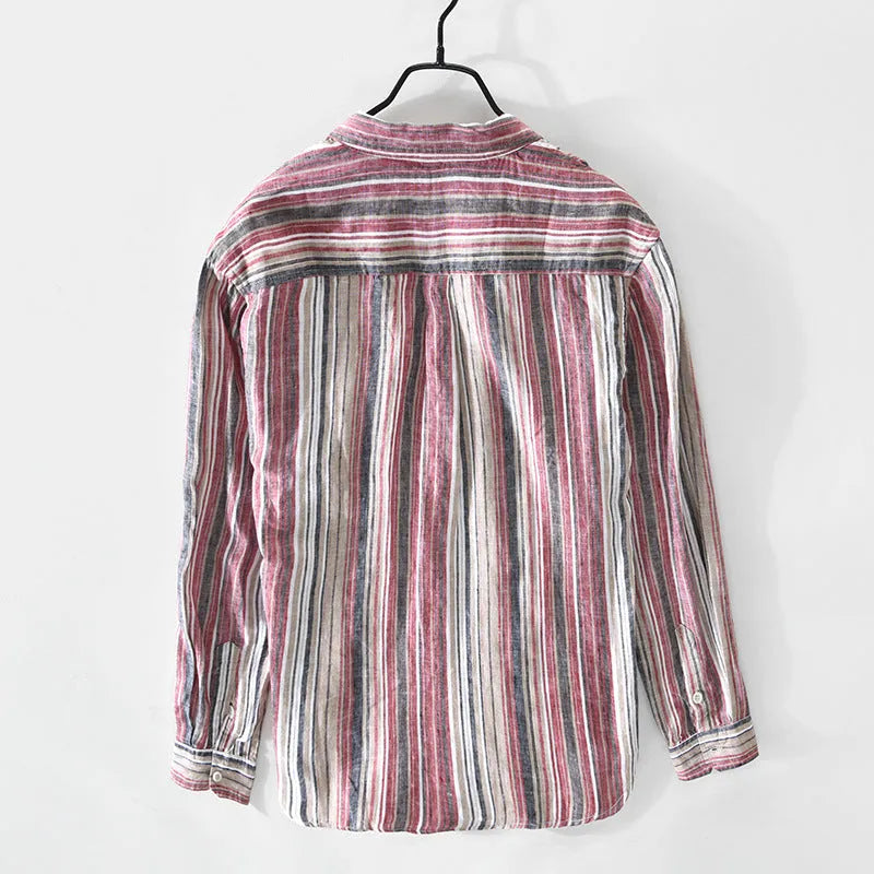 Grey striped linen shirt with long sleeves on male model showing loose casual fit
