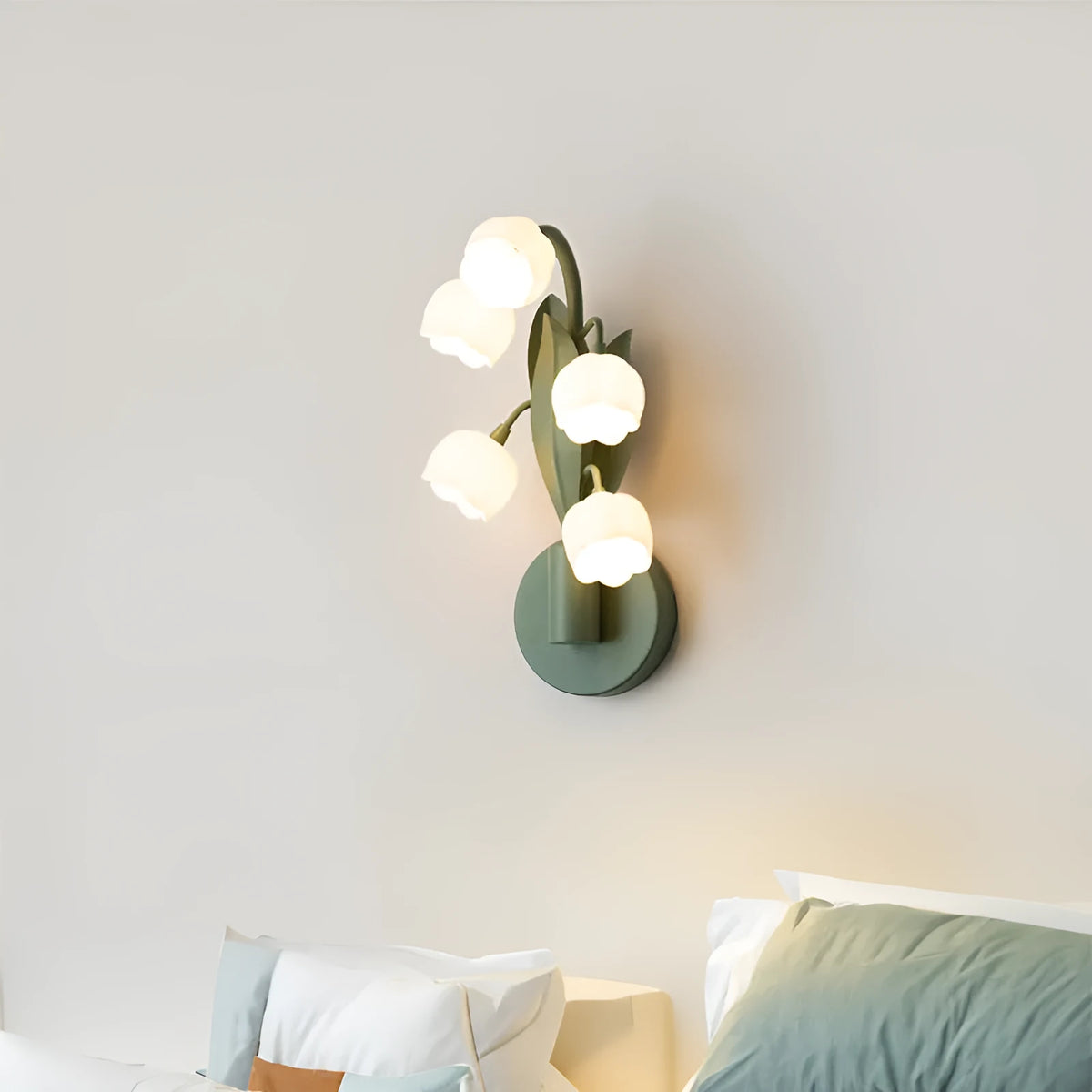 Green tricolour French pastoral wall lamp with minimalist Nordic design and white PC shade mounted on a wall.