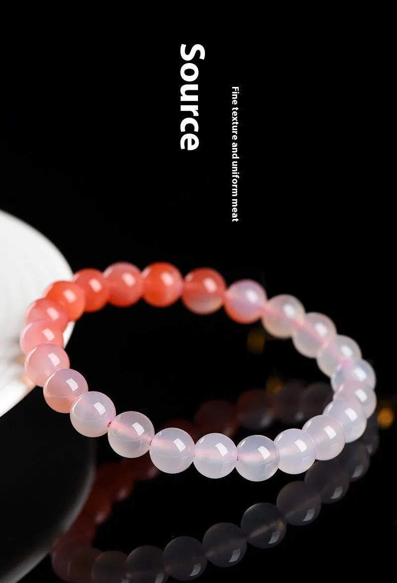 Natural gradient Yanyuan agate bracelet in geometric beads on a wrist.