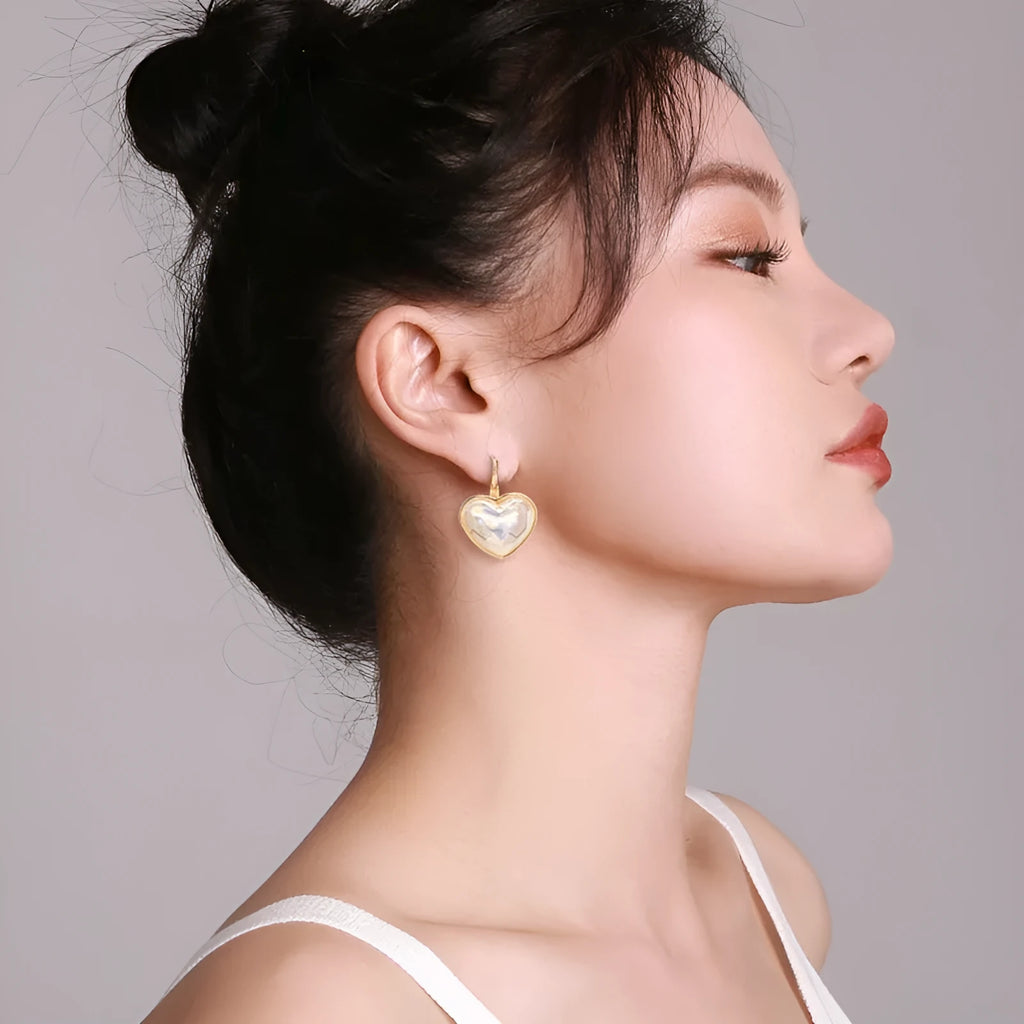 A pair of gold-coloured alloy clip-on earrings for women with a natural style.