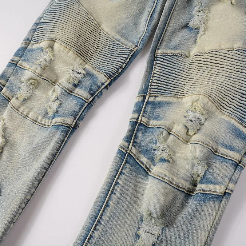 Light blue men's slim stretch jeans with hand-frayed distressing on the knees and hem.