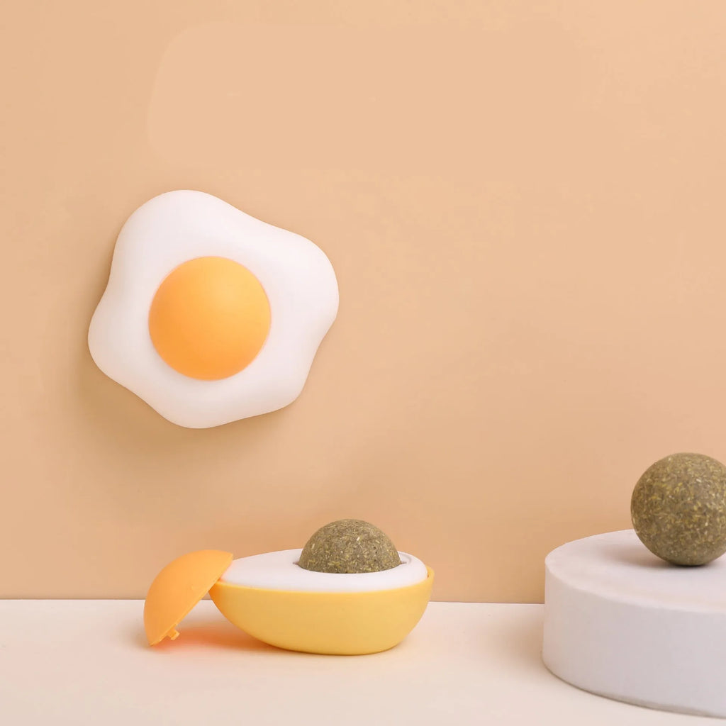 Interactive catnip ball toy in fried egg and poached egg shapes with natural filling