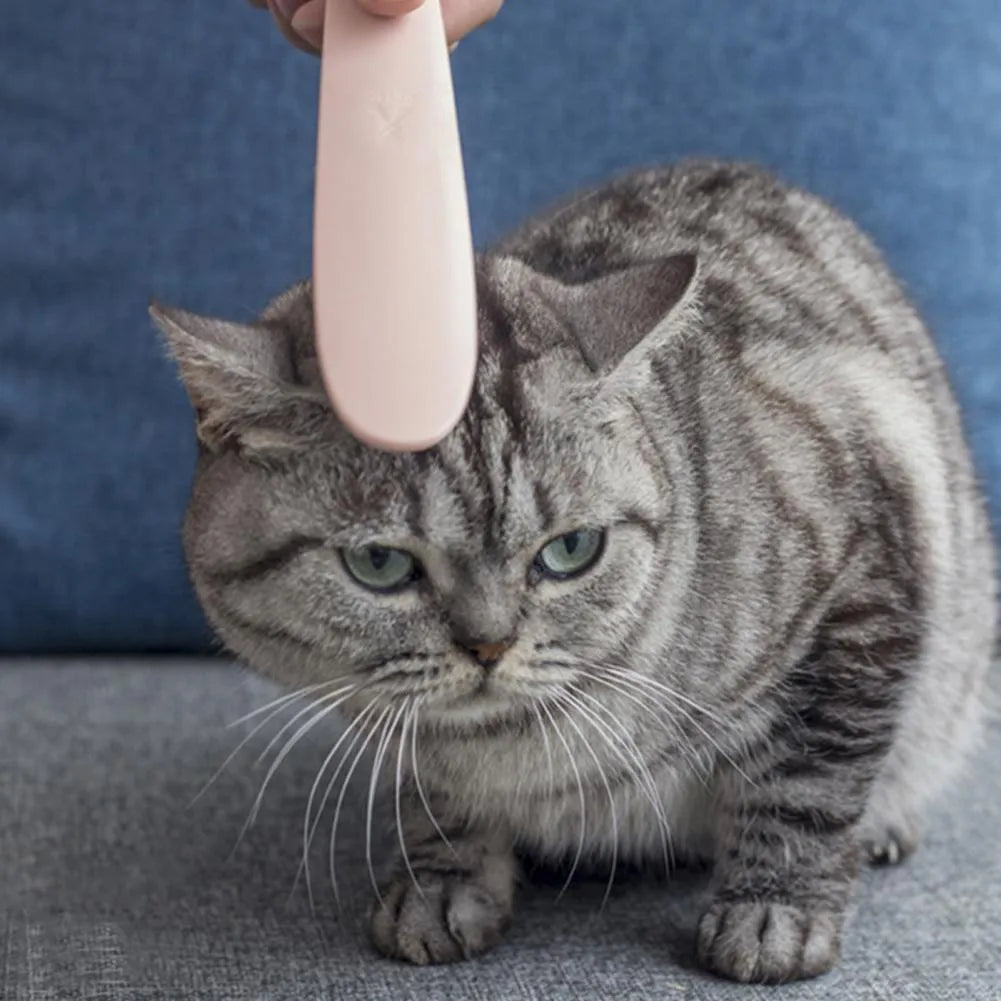 Grey and pink ABS plastic cat grooming comb with dual-width teeth design for pet hair removal