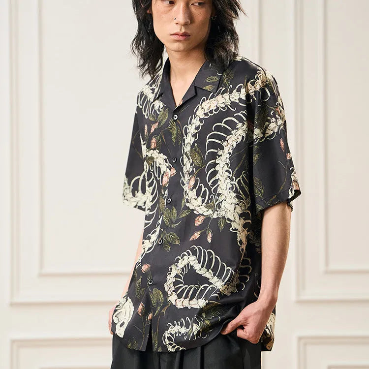 Short sleeve Cuban collar shirt with printed snake bone floral pattern in loose fit.