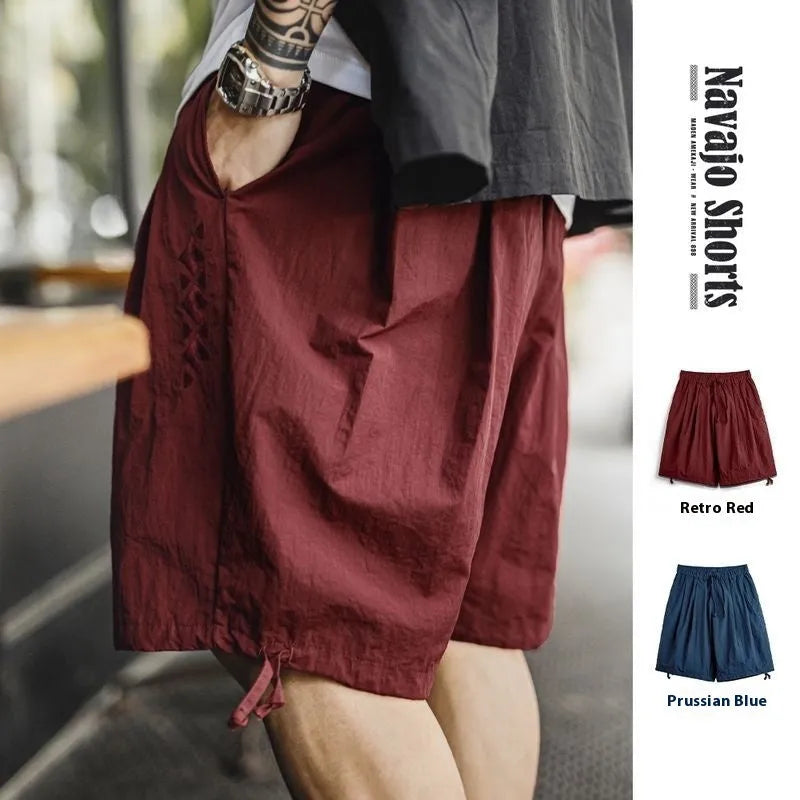 Men's loose fit embroidered beach shorts in Prussian Blue nylon fabric