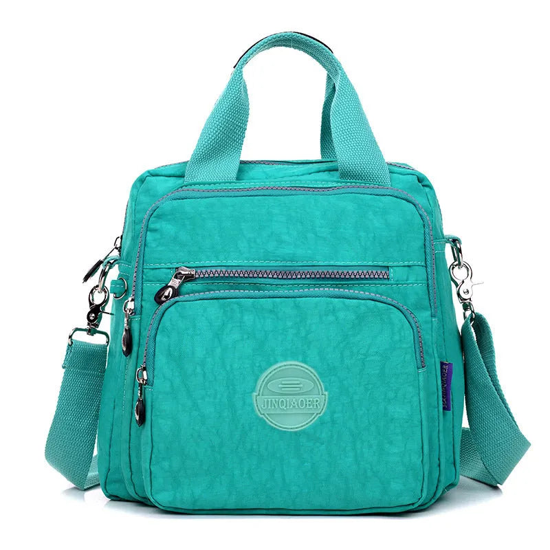 Ladies waterproof nylon cross-body shoulder bag, 25cm high, 24cm long, 12cm thick, in dark blue, black and beige.