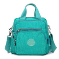 Ladies waterproof nylon cross-body shoulder bag, 25cm high, 24cm long, 12cm thick, in dark blue, black and beige.