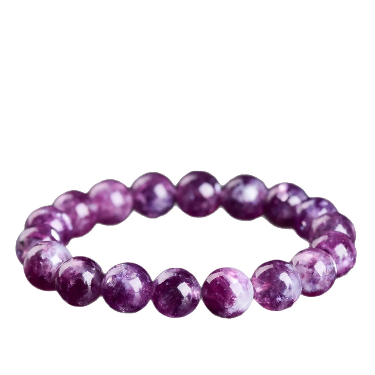 Grandmother Crystal Bracelet with polished purple beads in geometric shapes on a wrist.