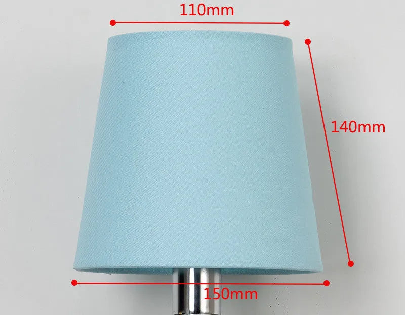 Modern minimalist white fabric lampshade on a wooden table next to other colour options.