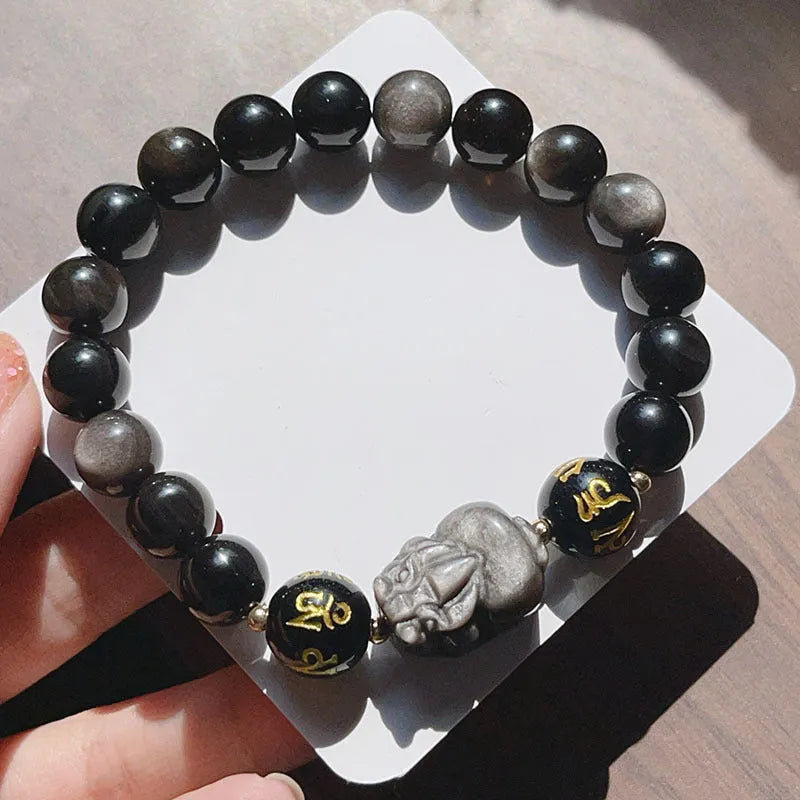 Close-up of a men's adjustable Silverstone bracelet with Chinese zodiac beads and six-word proverbs.
