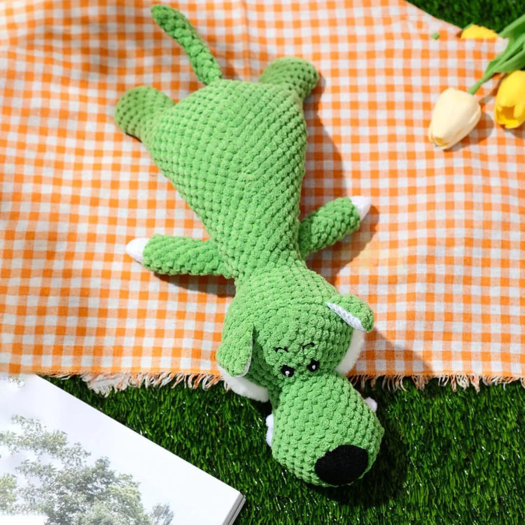 Plush dog chew toy with corn kernel texture and animal shape in green, grey, or yellow colours