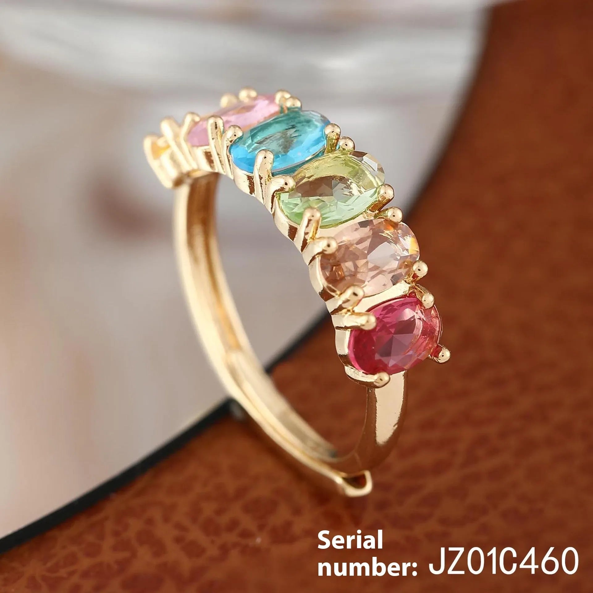 Gold-colour adjustable zircon ring with a simple retro design on a copper band.