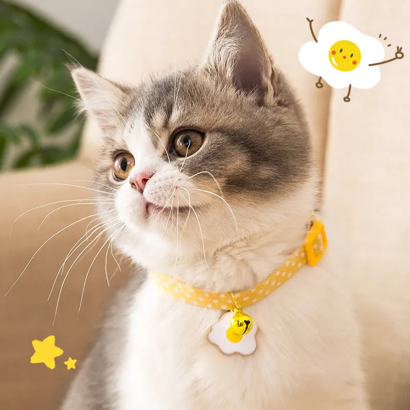 Green adjustable cat collar with metal bell pendant and matching bow tie accessory for small pets