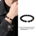 Black obsidian bracelet with silver prayer wheel centrepiece for men