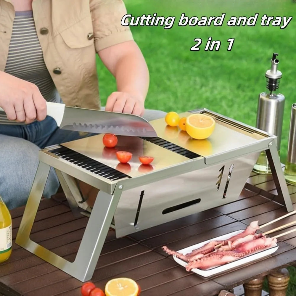 Small portable folding metal charcoal grill for outdoor barbecues.