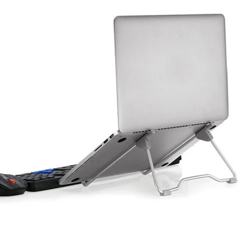 Grey aluminium alloy and plastic folding stand holding a mobile phone and a small laptop.