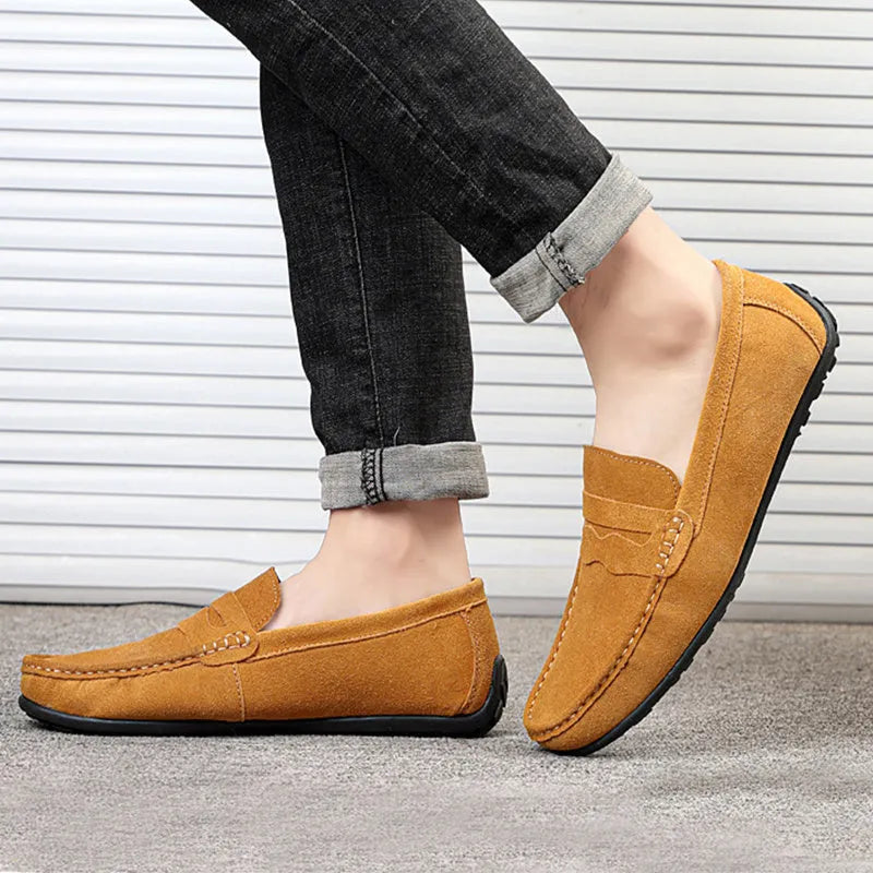 Men's brown suede slip-on loafers with round toe and flat rubber sole