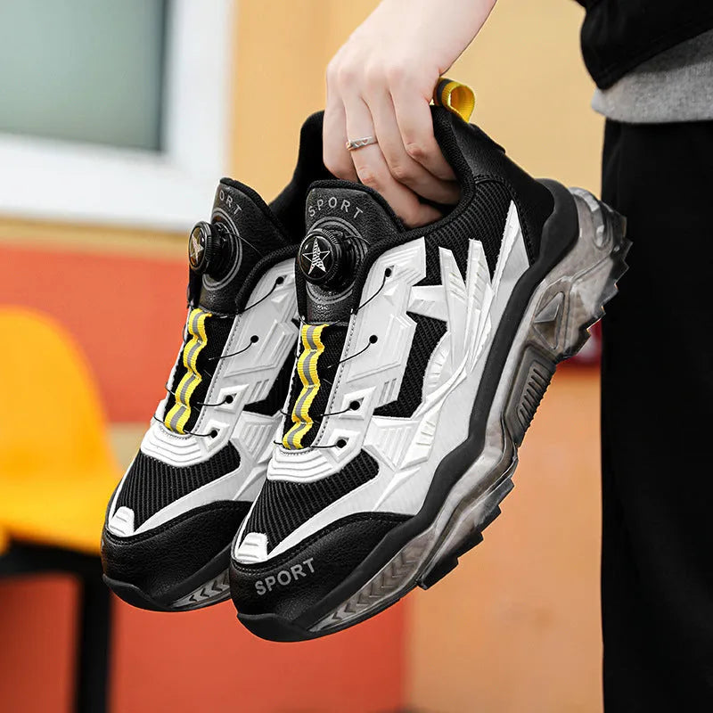 Men's black casual sneakers with rotating button closure and mesh upper on platform sole