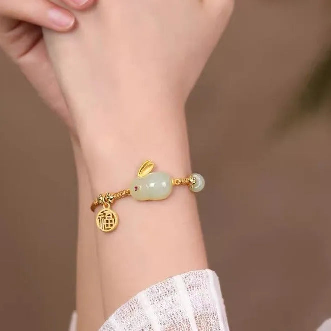 Hetian jade rabbit bracelet with geometric charm on yellow adjustable string