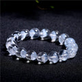 Women's white crystal ghost pyramid bracelet with Ruyi charm in graduated sizes