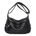 Large black or blue soft PU women's shoulder bag with crossbody strap and multiple internal pockets