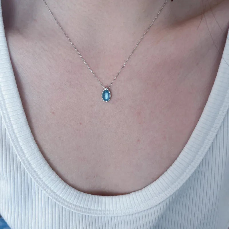 Navy blue geometric water drop necklace with adjustable chain and cross chain design