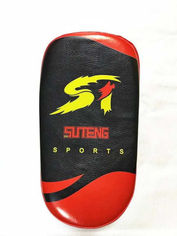 Red and black square hand-held martial arts training pad for kicks and punches.