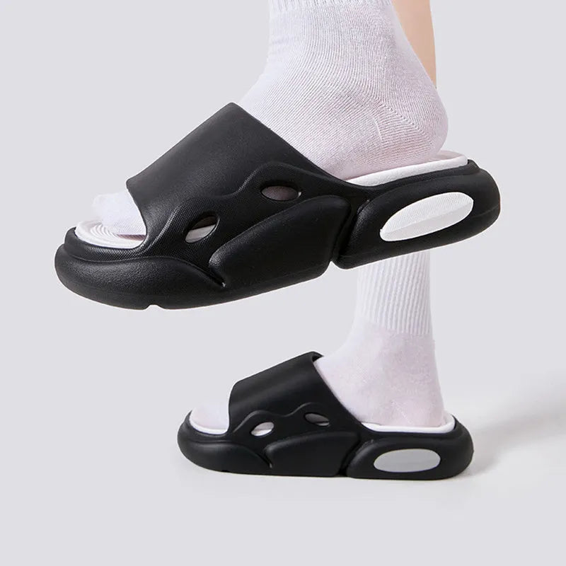 Women's two-colour EVA slippers with thick sole and leather lining in pink purple, shown on a foot.