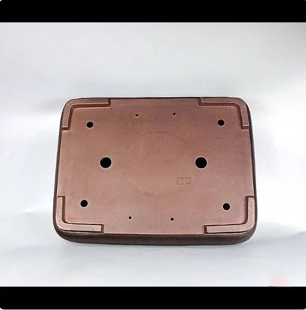 Handmade antique rectangular purple clay flower pot showing traditional ceramic texture