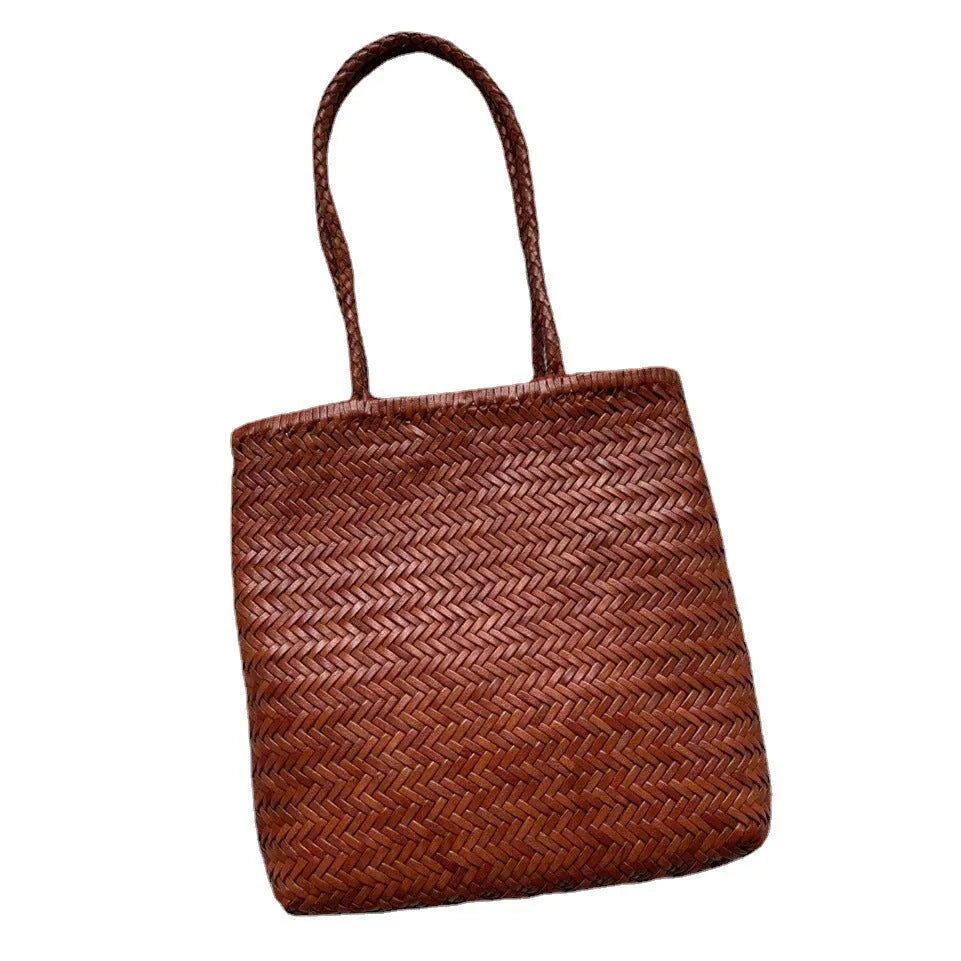 Brown woven leather tote bag with three-dimensional pockets measuring 27cm high by 30cm wide
