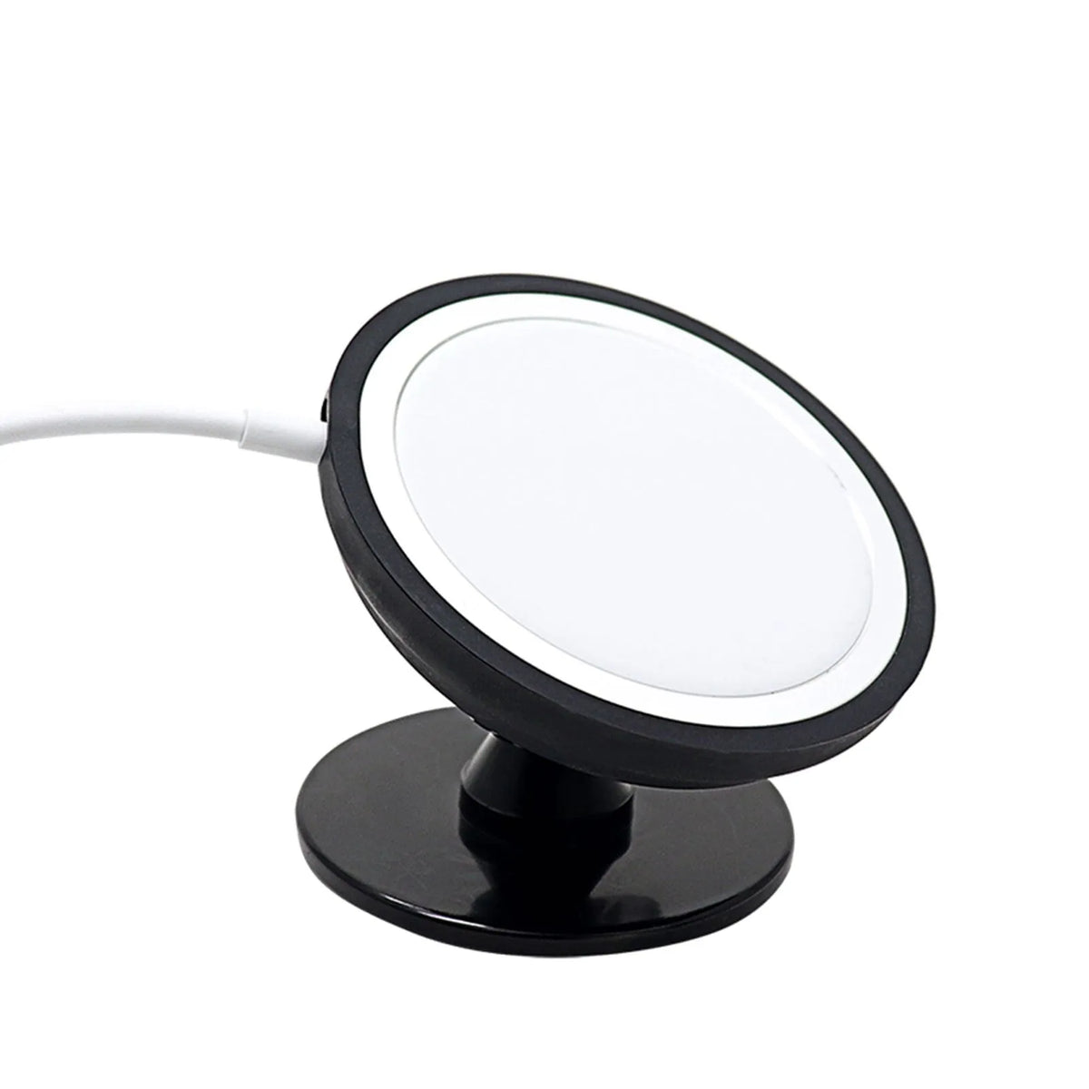 Black magnetic car phone holder mounted on vehicle air vent with smartphone attached