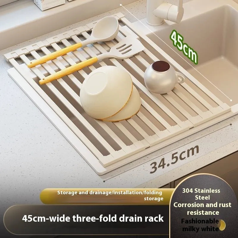 Foldable milky white stainless steel kitchen draining rack beside a sink