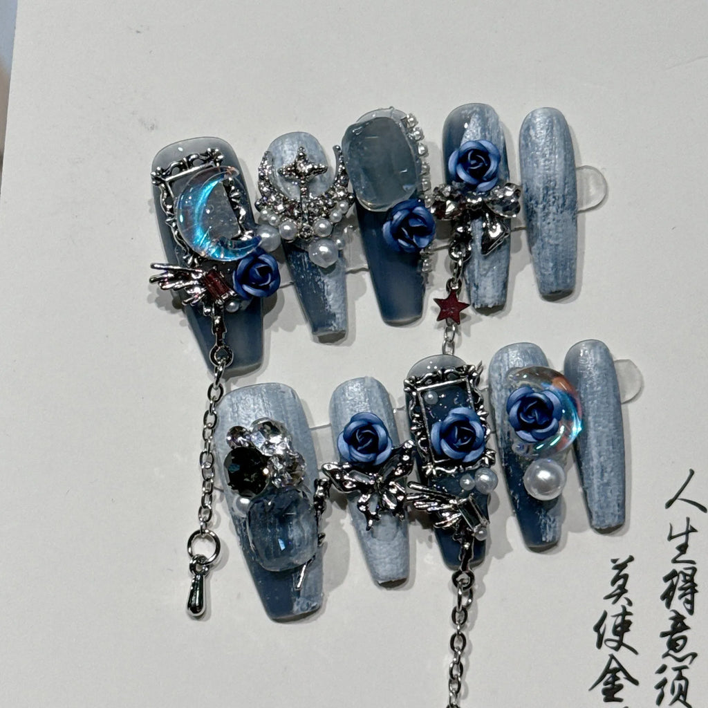Blue night nail armour with ornate rose and tulip floral patterns in plastic evening manicure set