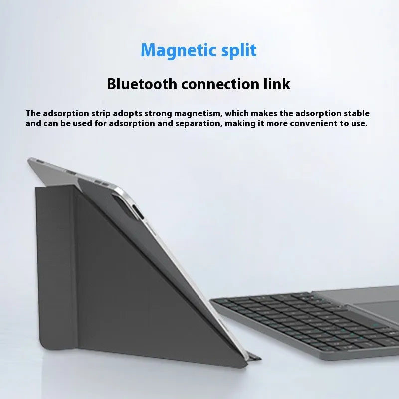 Grey wireless Bluetooth folding keyboard for mobile phones and tablets showing collapsed portable design