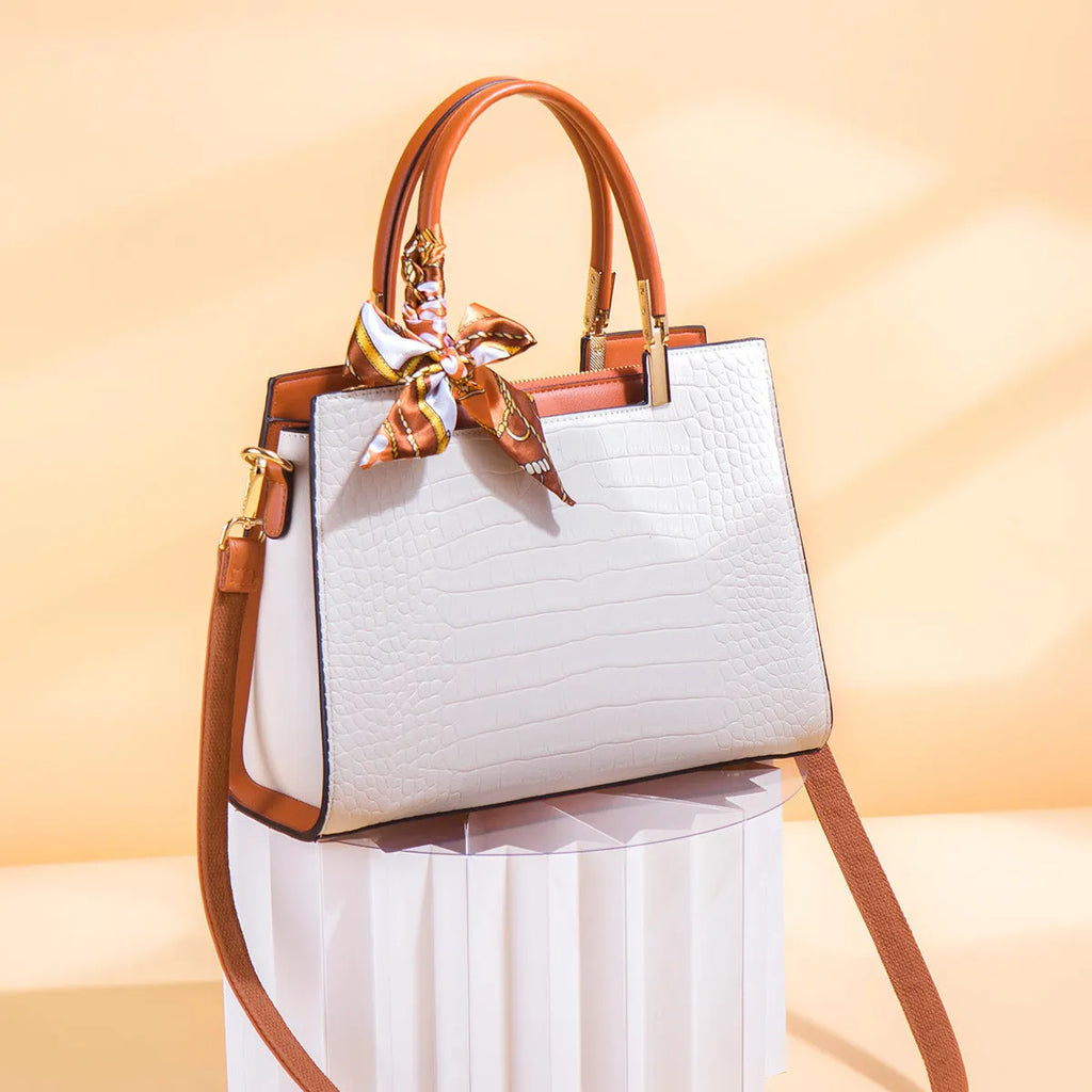 Milky white women's large-capacity PU shoulder handbag with internal organisers and slit pocket.