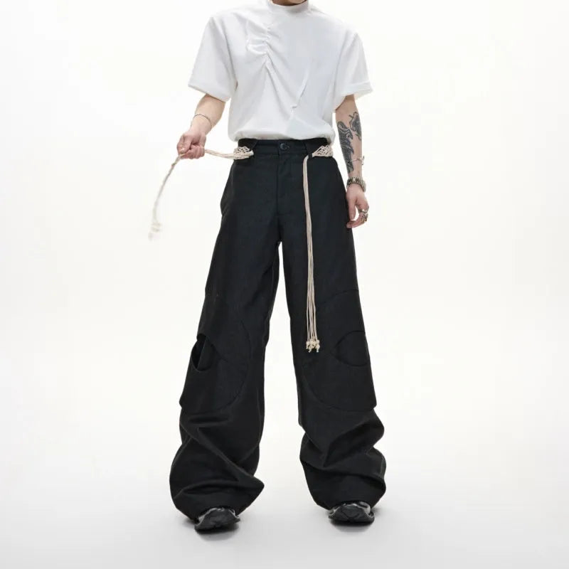 Men's dark blue loose fit straight leg jeans with zipper decoration and belt stitching detail.
