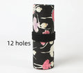 Canvas roll-up pencil case with ballet girl print, shown unrolled to display multiple pencil loops.