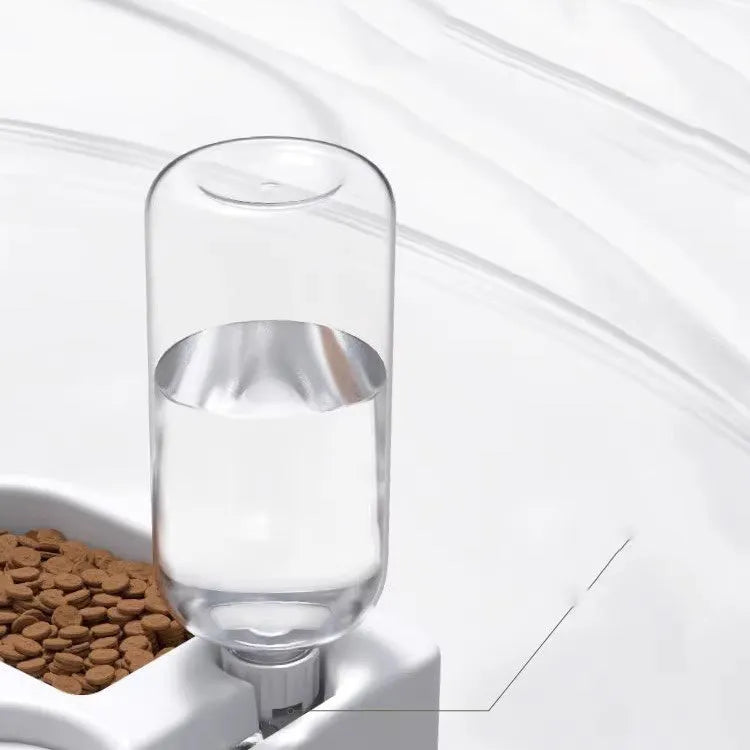 White pet water fountain with stainless steel top, showing water flowing from the centre.
