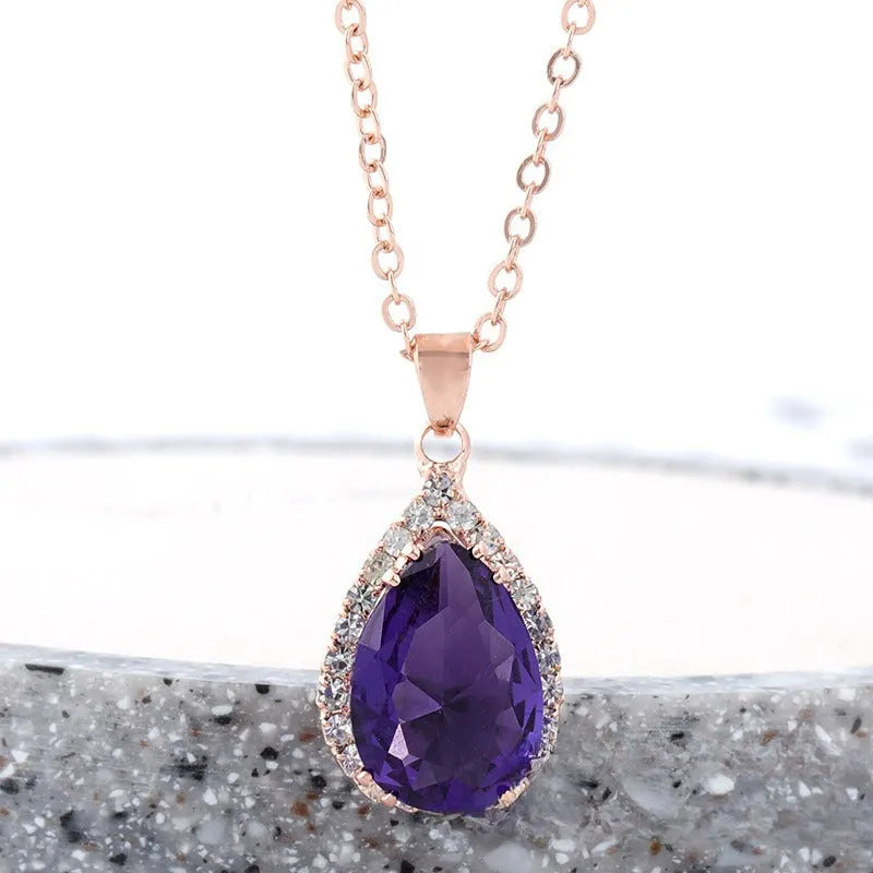 Rose gold water drop necklace with geometric rhinestone pattern in pink colour
