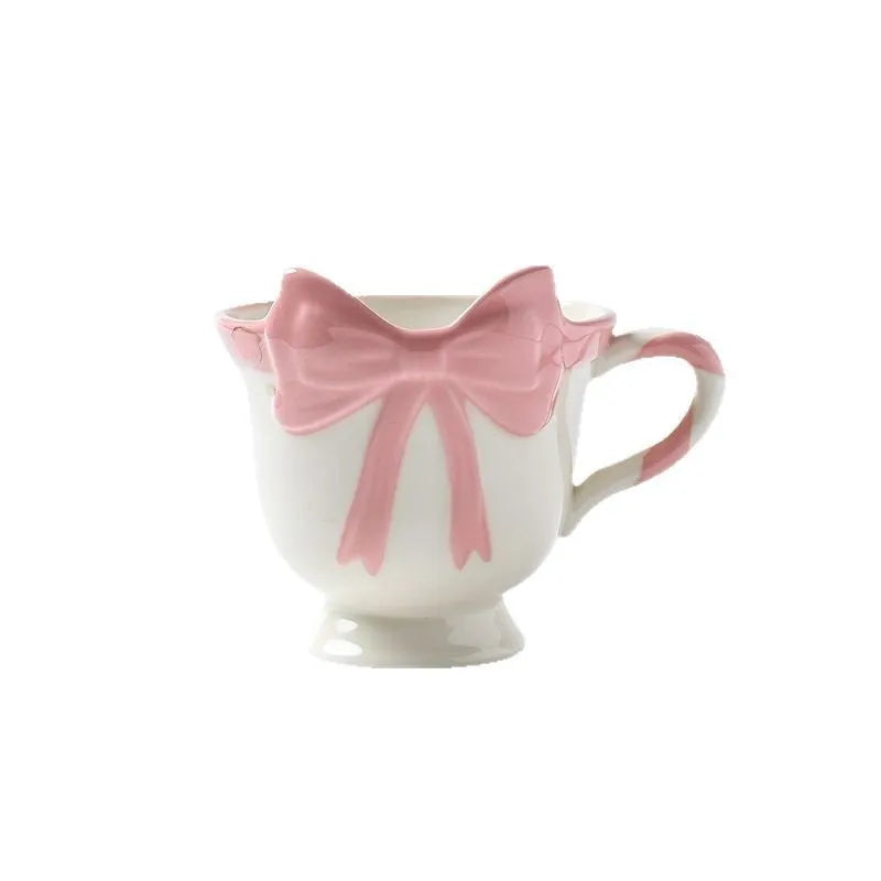 Ceramic mug with heart bow design in black pink or white powder colour, 301-400ml capacity