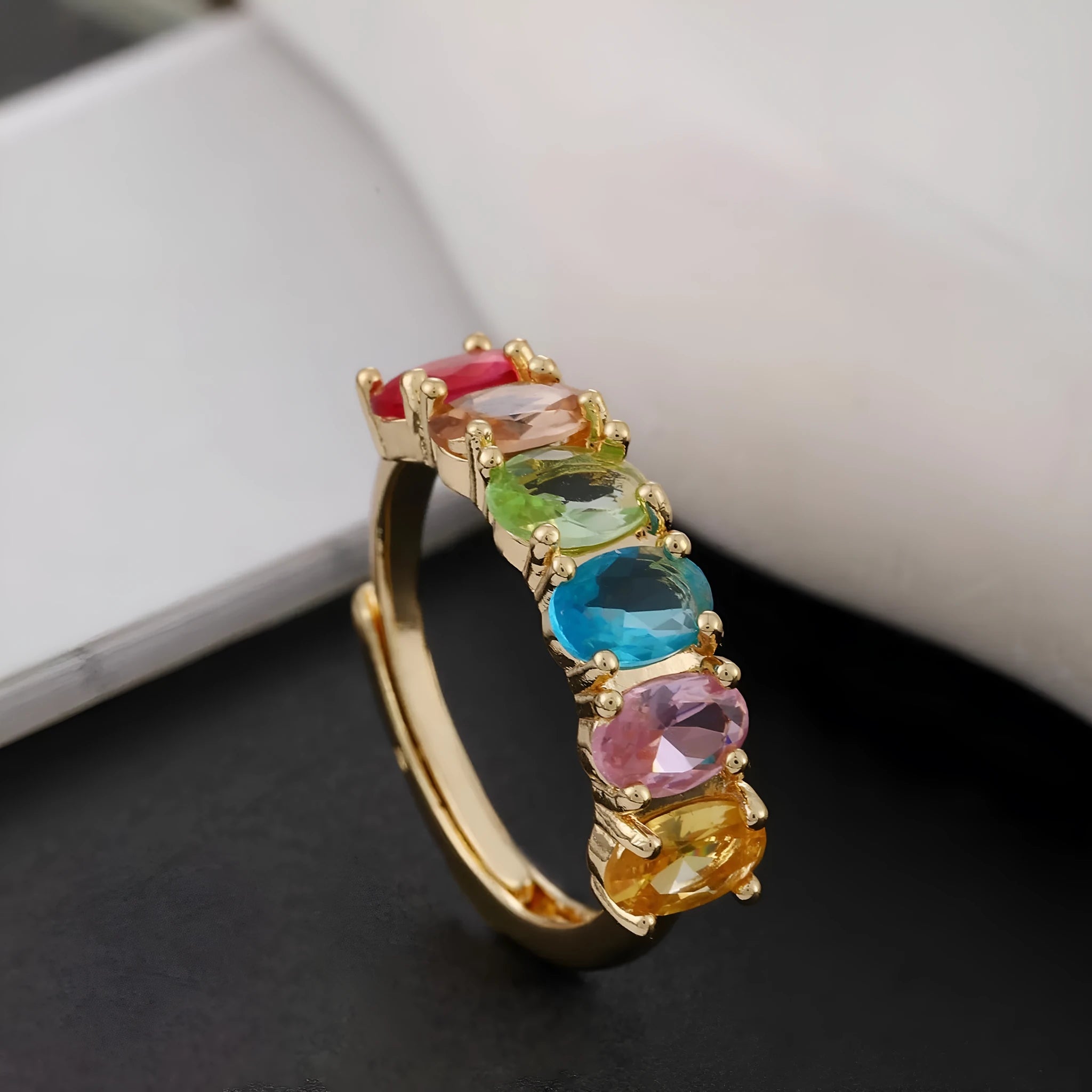Gold-colour adjustable zircon ring with a simple retro design on a copper band.