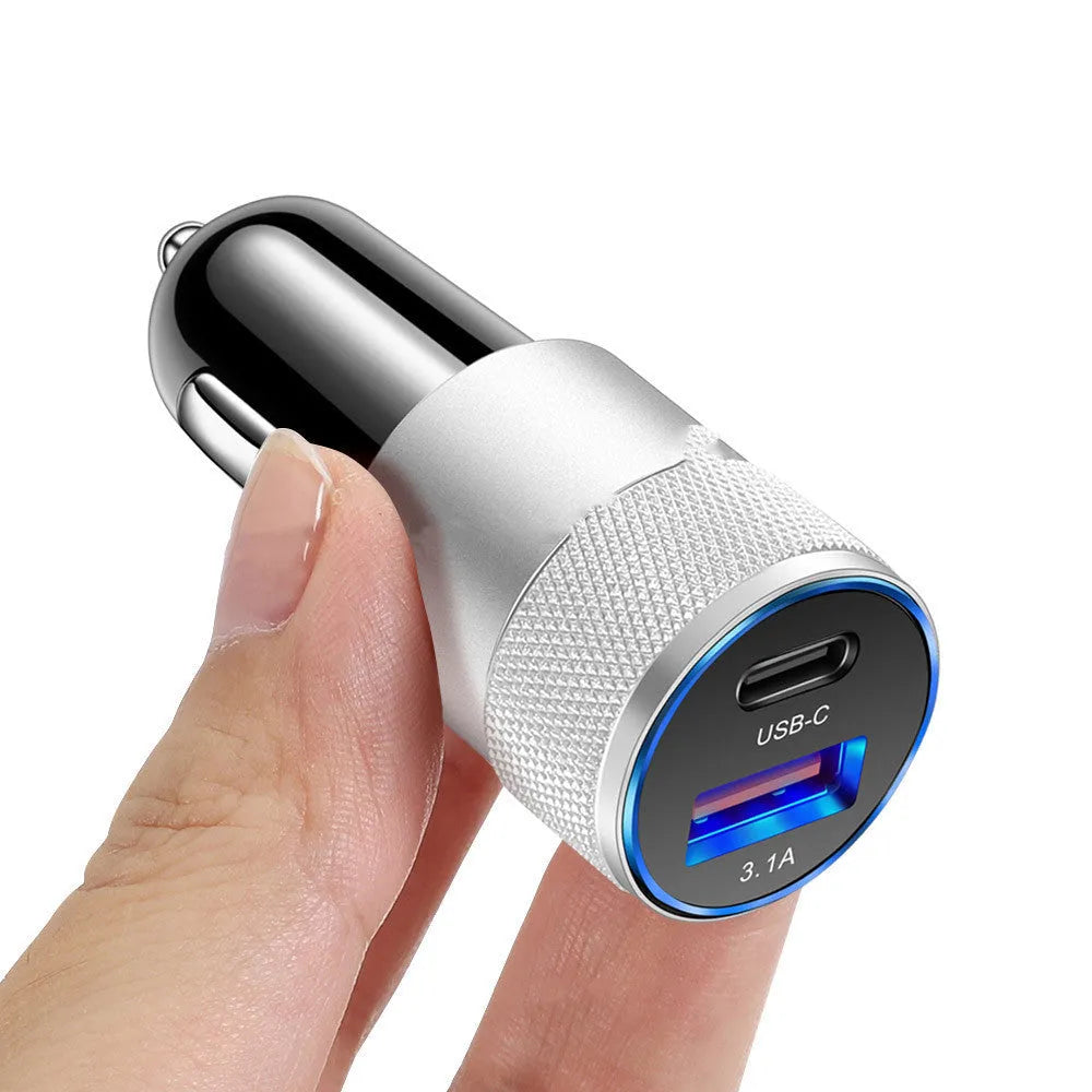 Compact black aluminium alloy mobile phone car charger for vehicle 12V socket.