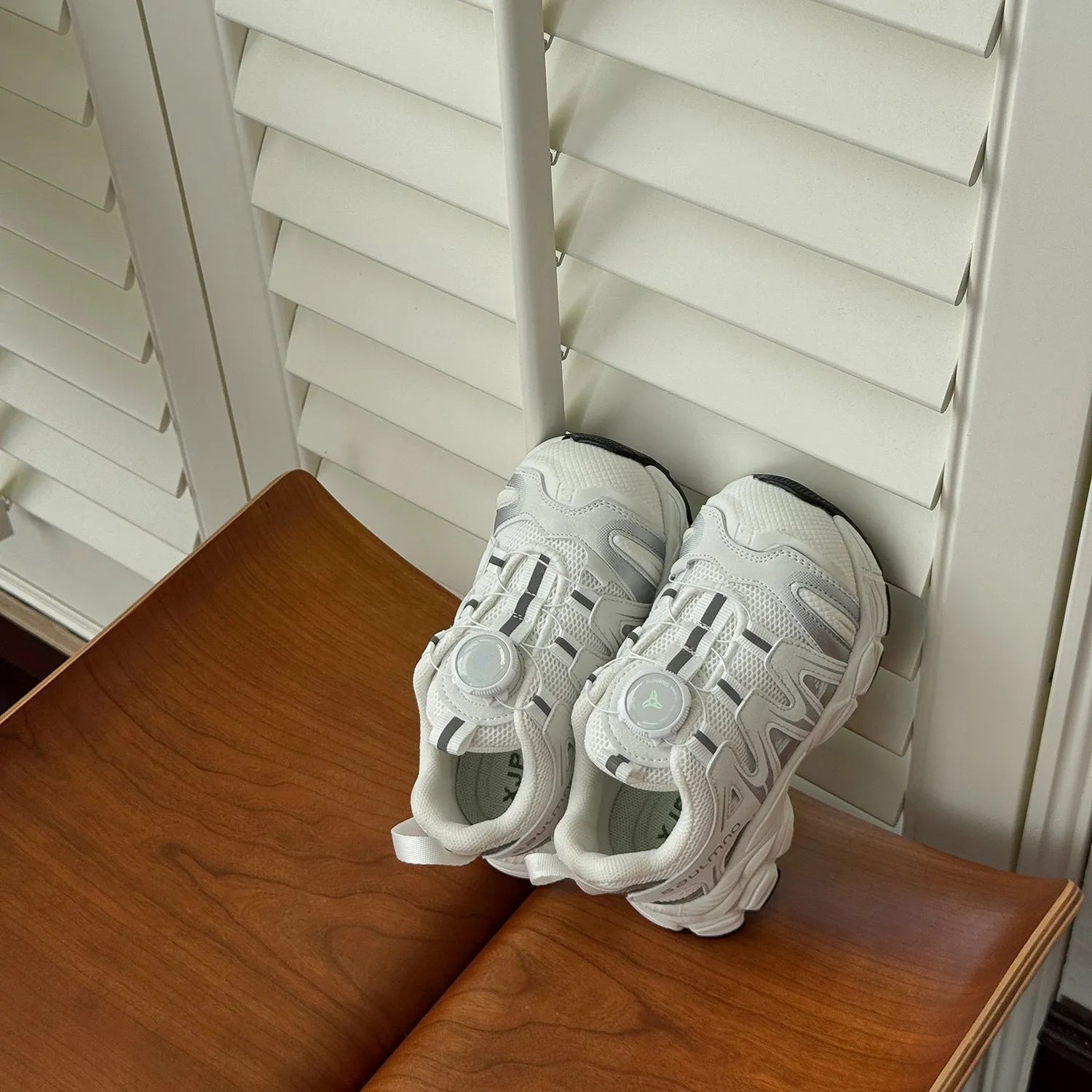 Girls casual trainers in beige with a breathable PU leather mesh upper, shown on a light background.