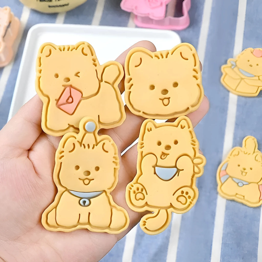 Plastic three dimensional biscuit mold with cartoon puppy designs including birthday hat style
