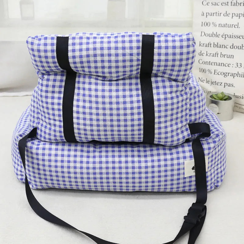 Grey and blue plaid car-mounted stain-resistant dog travel nest in two sizes.
