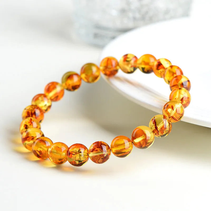Natural yellow piebald amber water purification bracelet with geometric beads