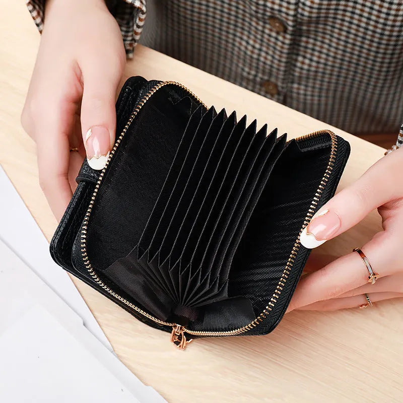 Short ladies wallet with lychee pattern in PU leather showing card slots and 2-fold construction