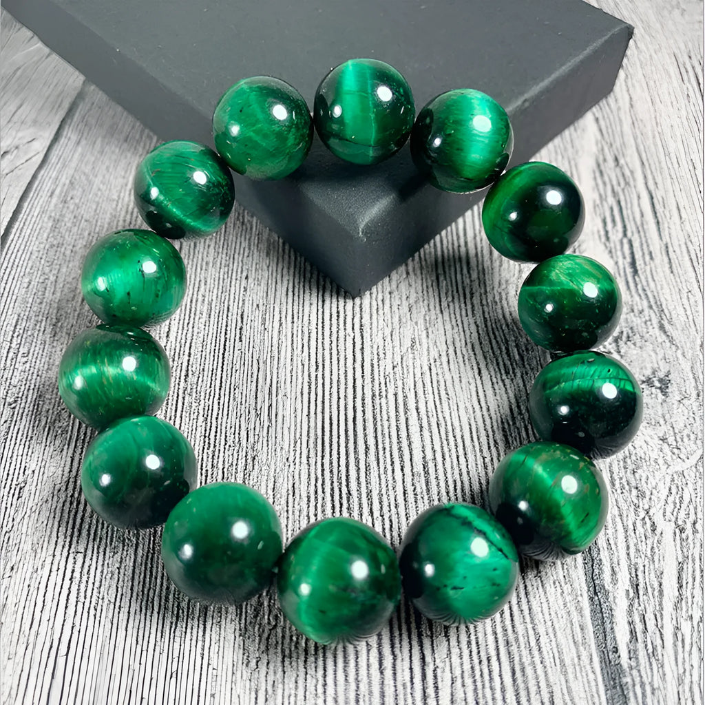A polished green tiger eye stone bracelet with geometric beads, shown in various size options.